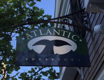 Sign of Atlantic Edgartown handing from a building
